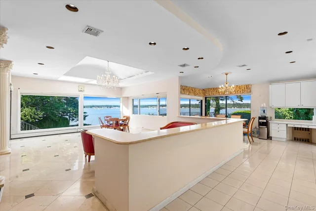 a view of kitchen with kitchen island and living room