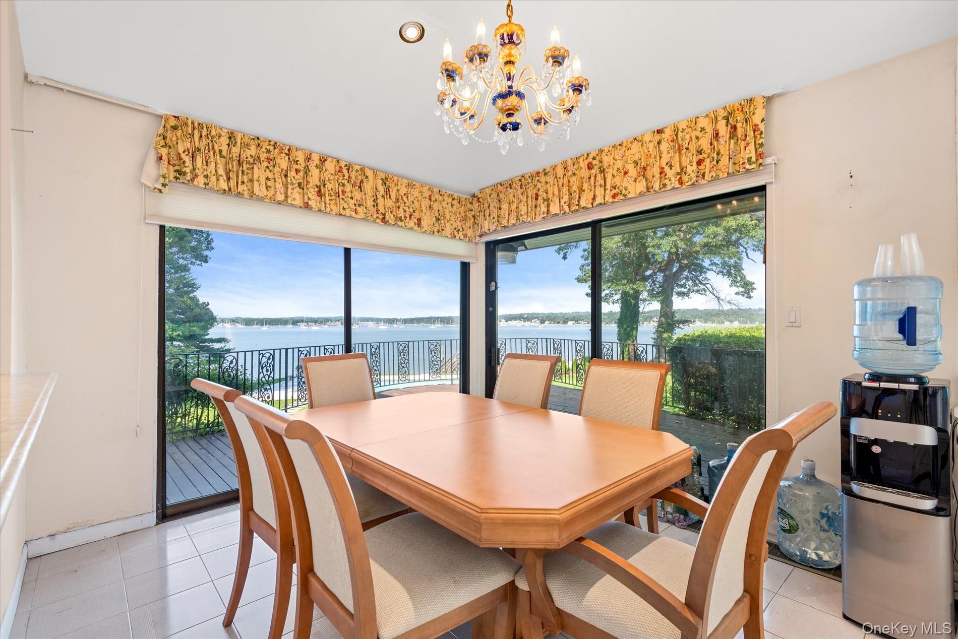 512 East Shore Road Great Neck, NY 11024 - Photo 23 of 46 a view of a dining room with furniture window and outside view