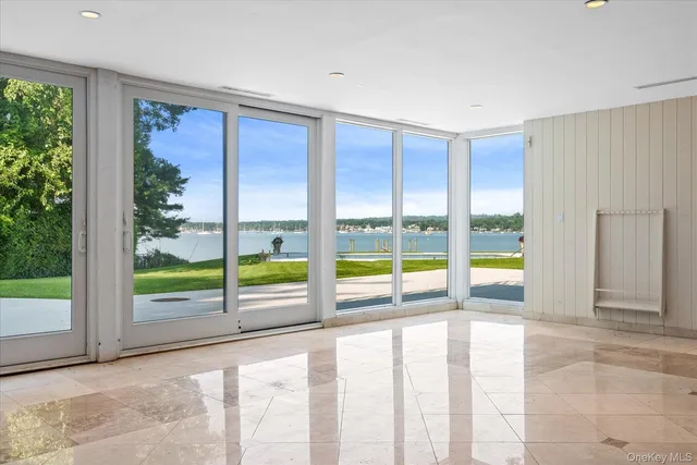 a view of an empty room with windows