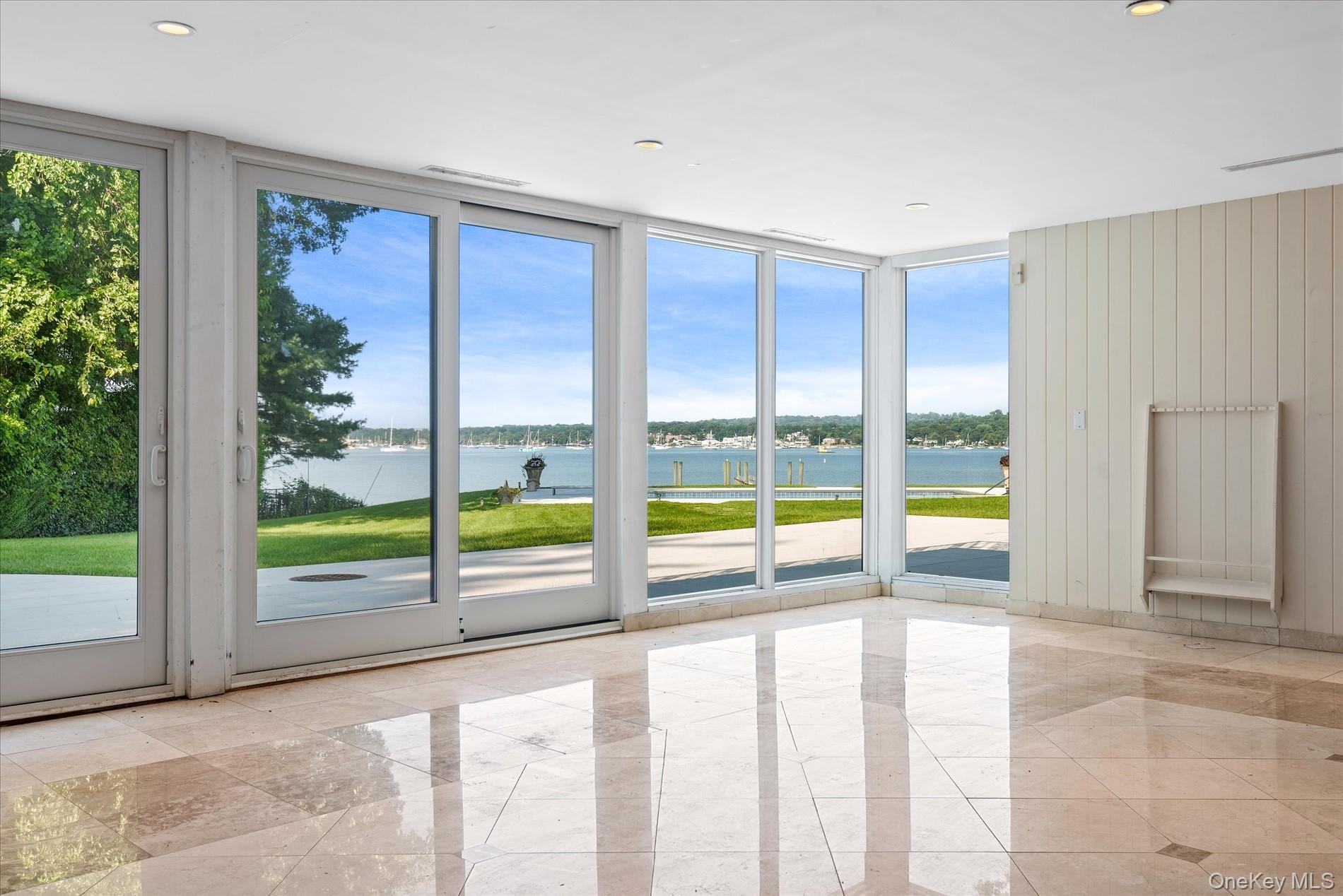 512 East Shore Road Great Neck, NY 11024 - Photo 25 of 46 a view of an empty room with windows