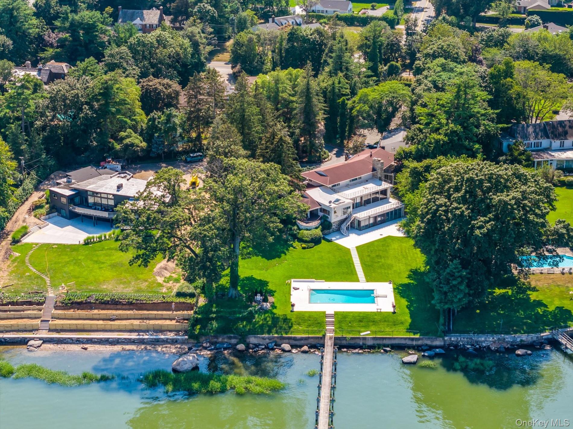 512 East Shore Road Great Neck, NY 11024 - Photo 3 of 46 an aerial view of residential house with outdoor space and swimming pool