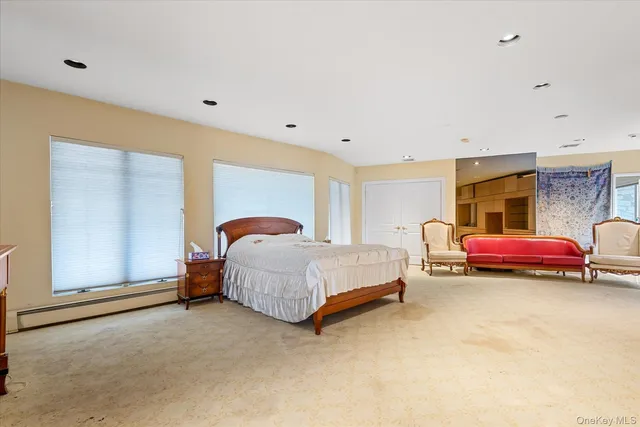 a bed room with a bed and a large mirror