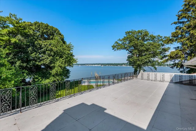 an aerial view of a house with swimming pool and garden
