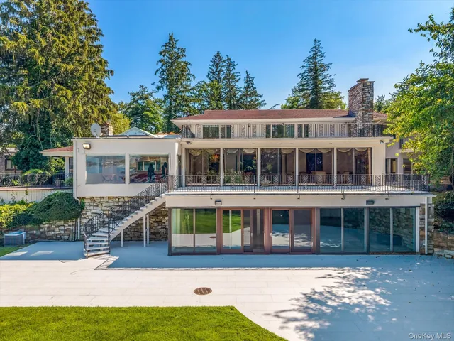 an aerial view of a houses with a lake and lake view