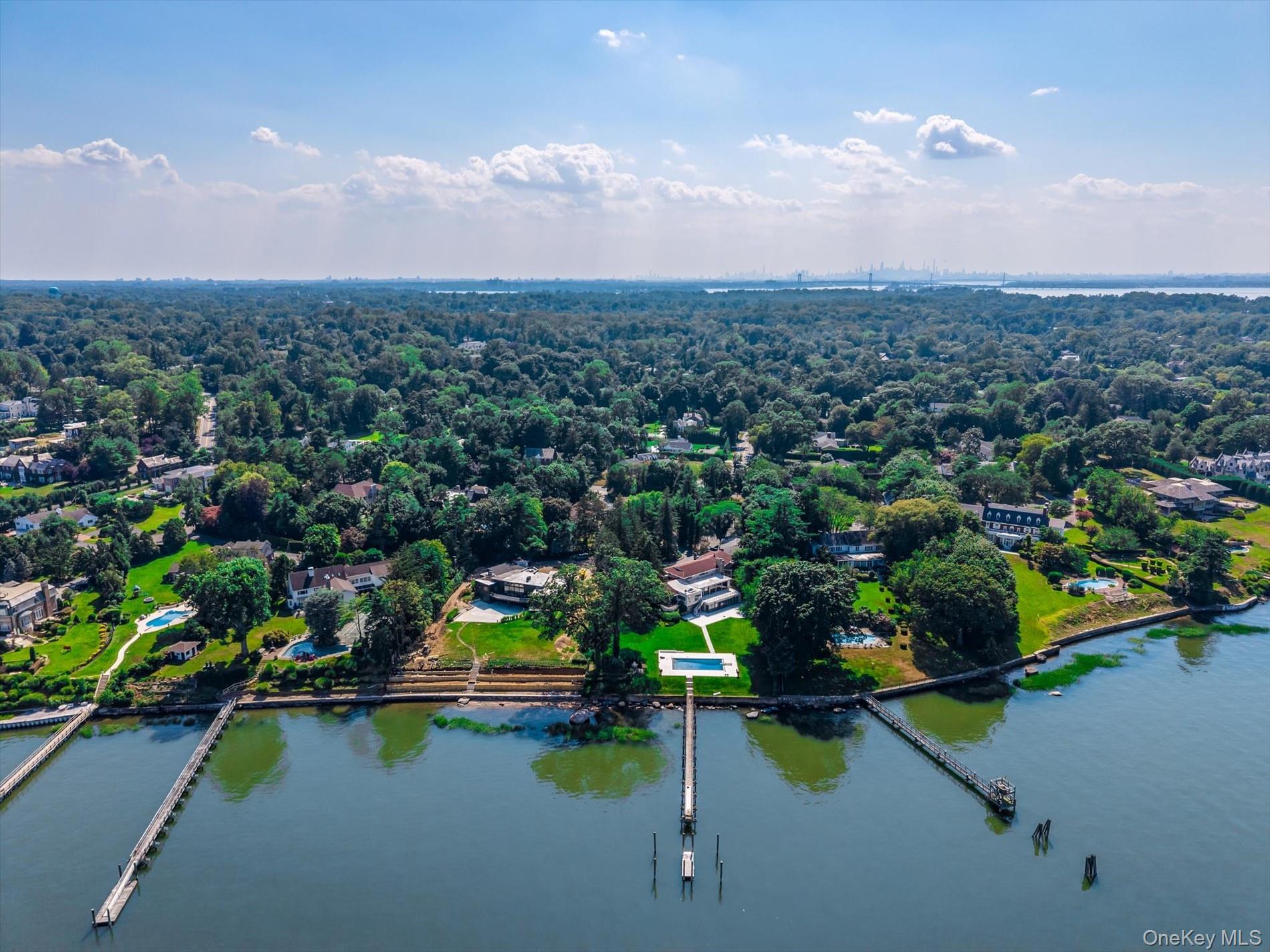 512 East Shore Road Great Neck, NY 11024 - Photo 41 of 46 an aerial view of a houses with a lake and lake view