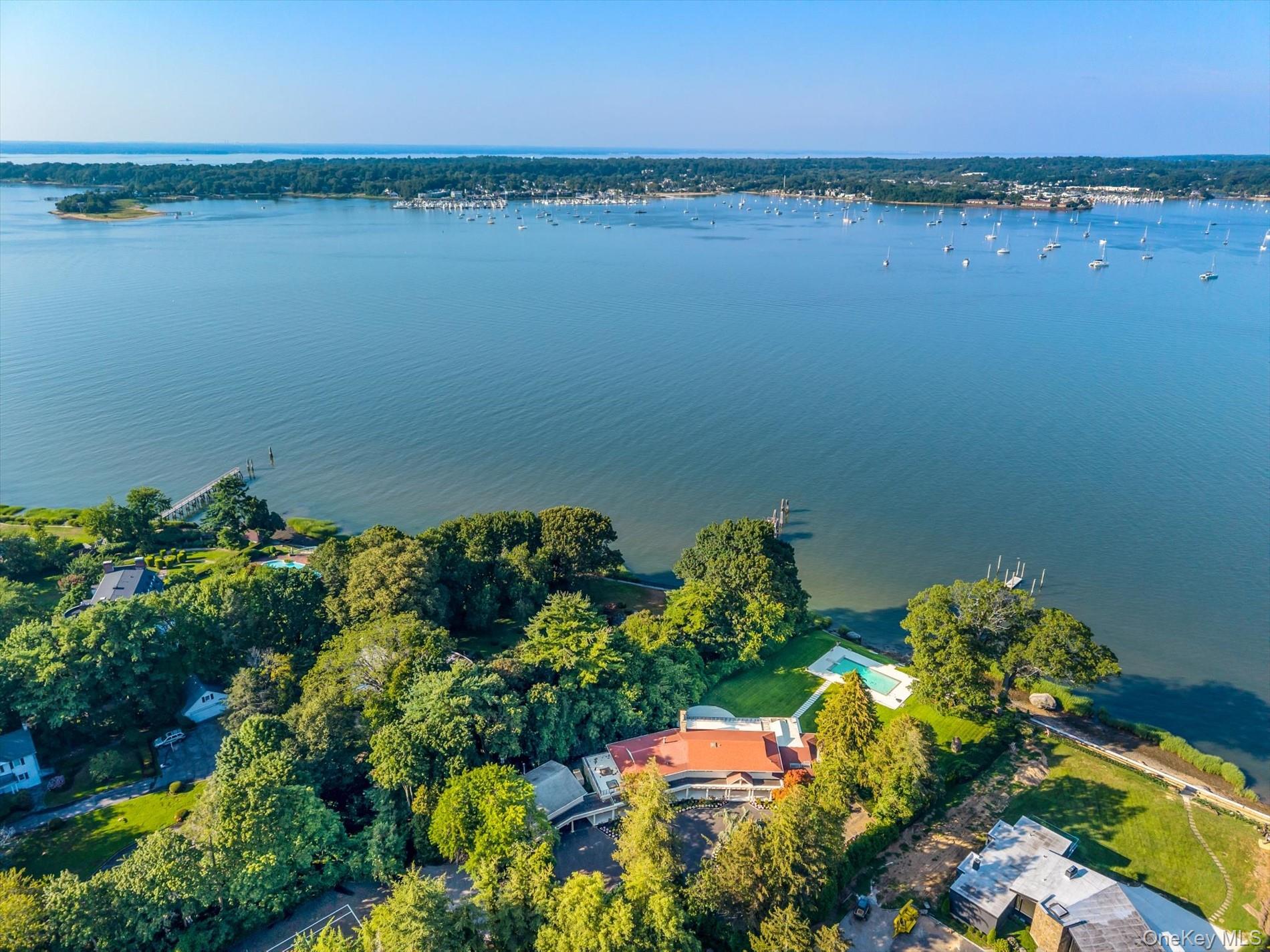 512 East Shore Road Great Neck, NY 11024 - Photo 42 of 46 a view of a lake with a house in the background