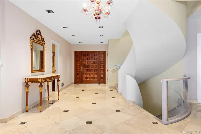 a view of an entryway with wooden floor