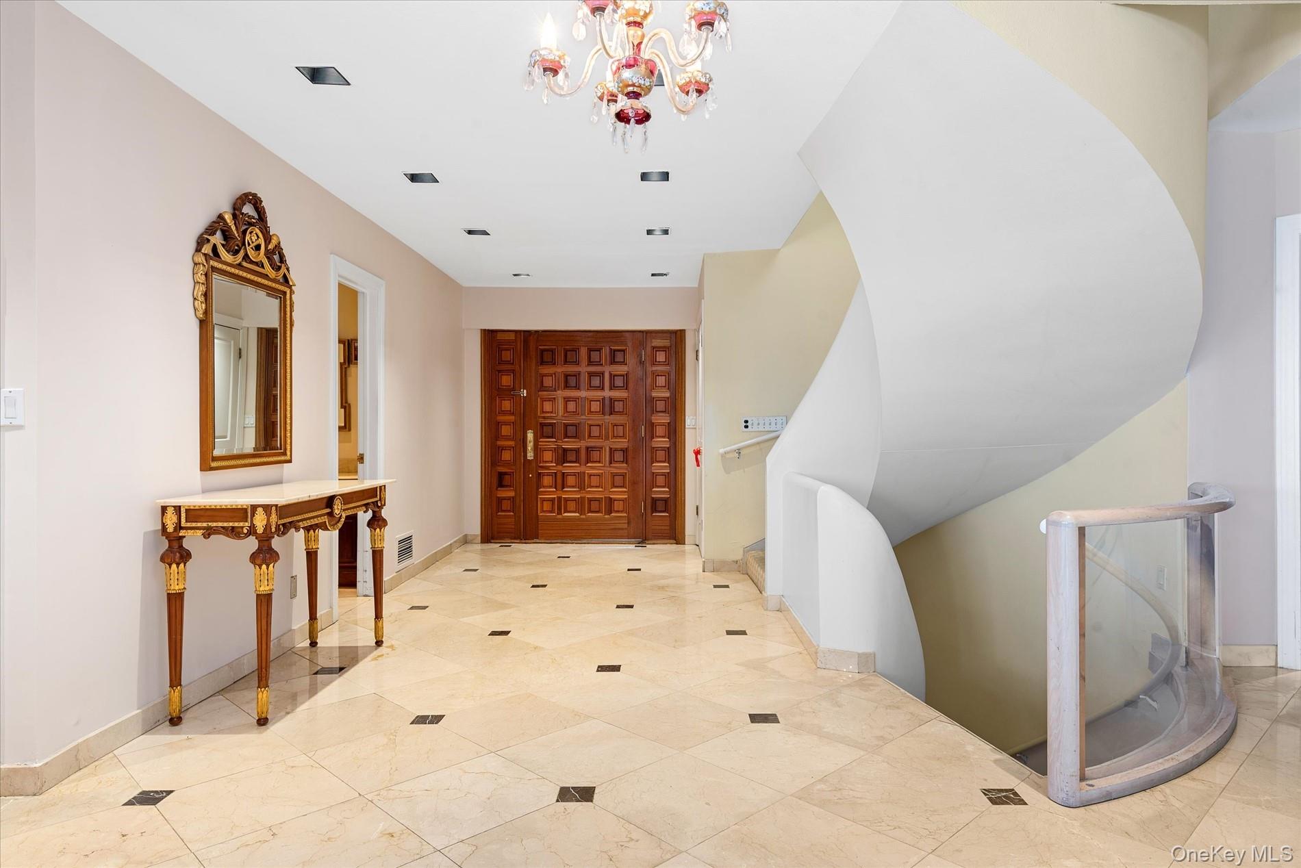 512 East Shore Road Great Neck, NY 11024 - Photo 9 of 46 a view of an entryway with wooden floor