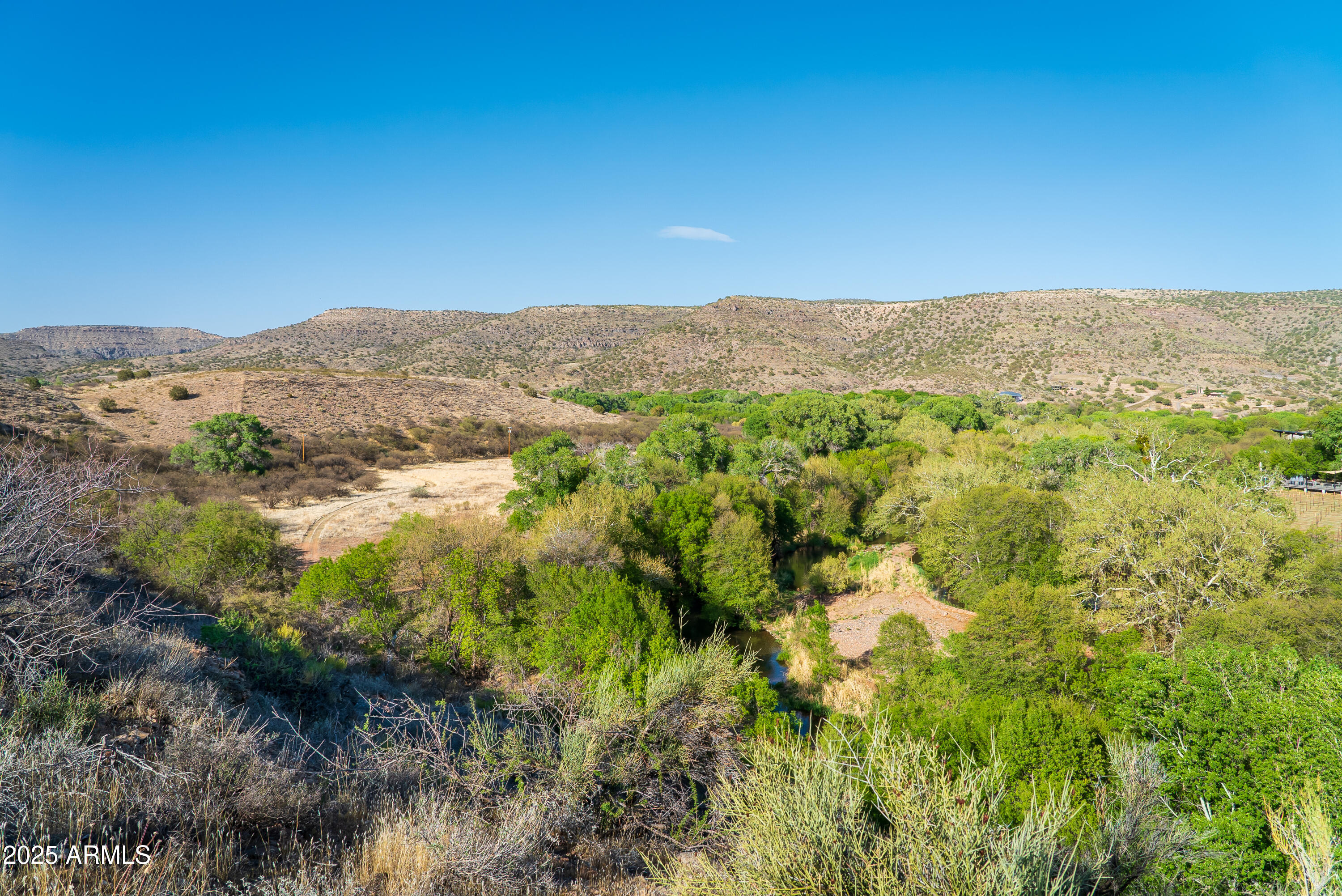 0 East Willow Point Road Cornville, AZ 86325 - Photo 12 of 16 a view of a lush green field with mountains in the background