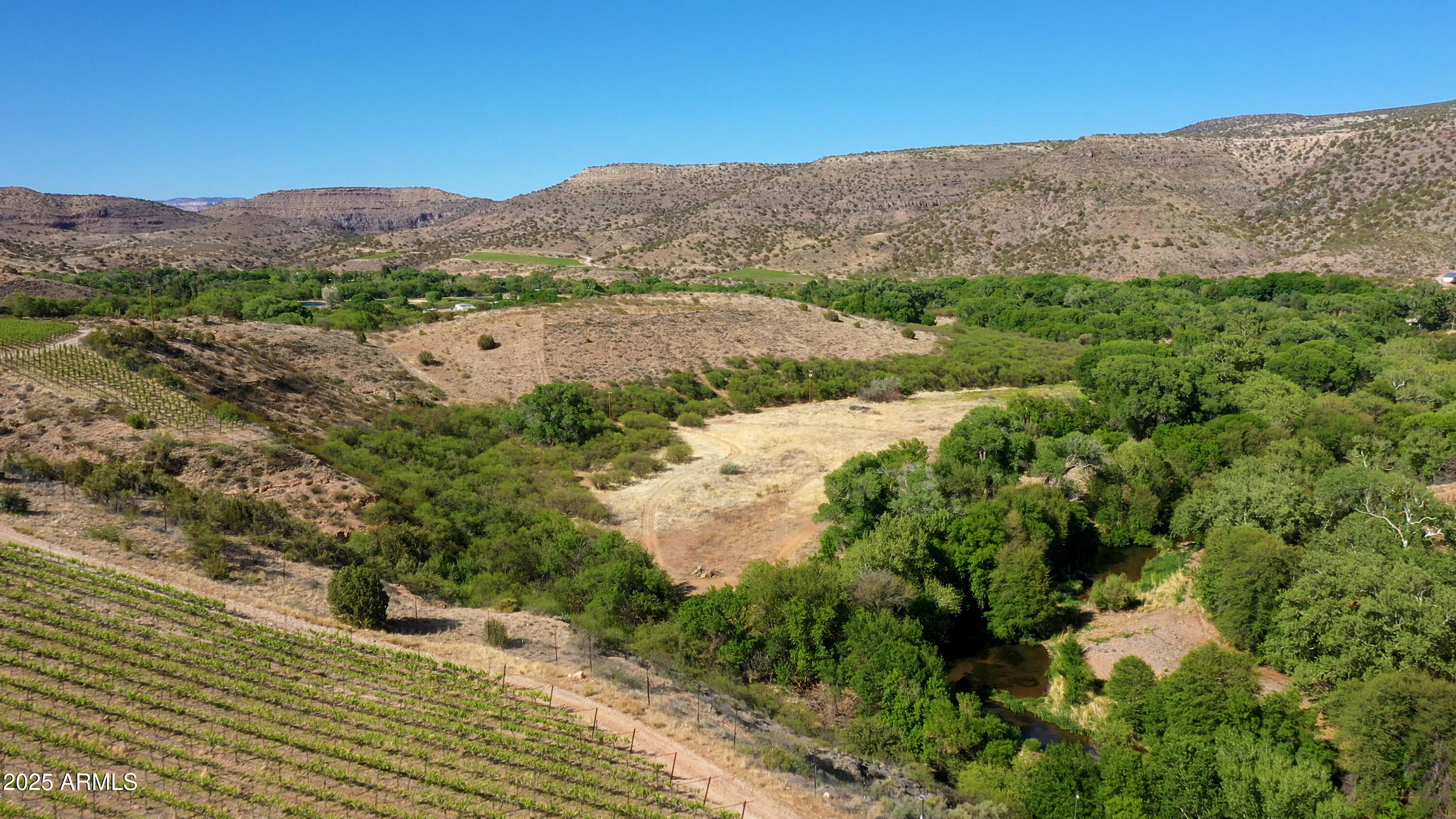 0 East Willow Point Road Cornville, AZ 86325 - Photo 14 of 16 an aerial view of mountain with residential house and mountains in the background