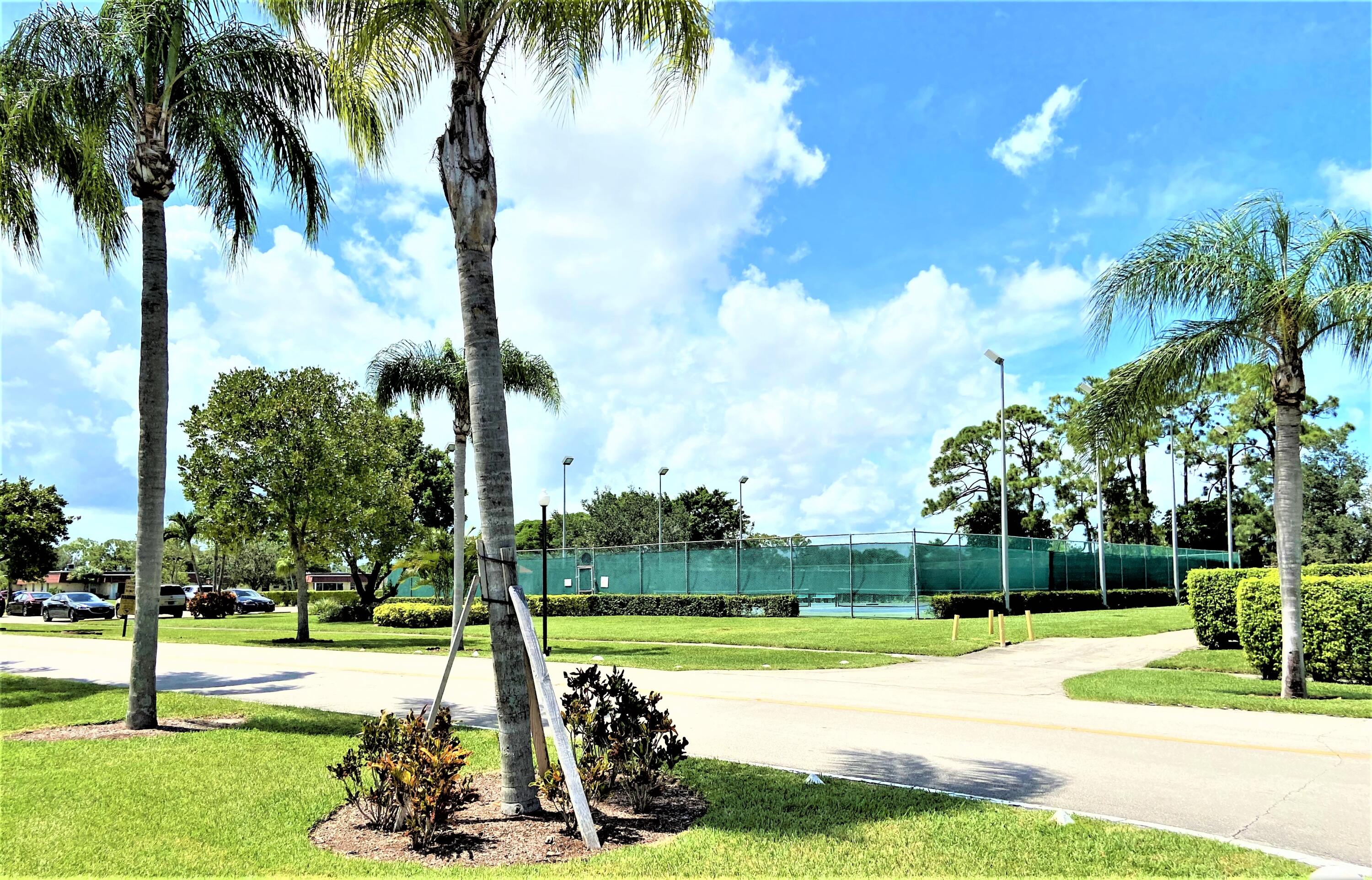 255 Down E Lane, Unit B Lake Worth, FL 33467 - Photo 27 of 31 a view of a park with palm trees