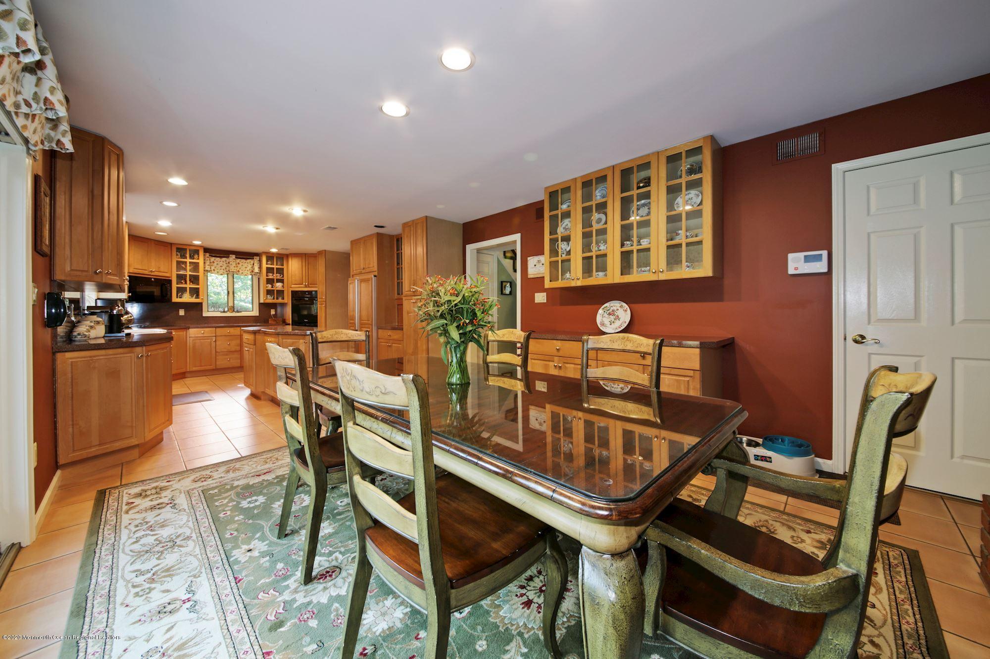 12 Belaire Road Marlboro, NJ 07746 - Photo 9 of 23 Eat-in area of kitchen with fireplace