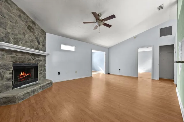 a view of an empty room and fire place