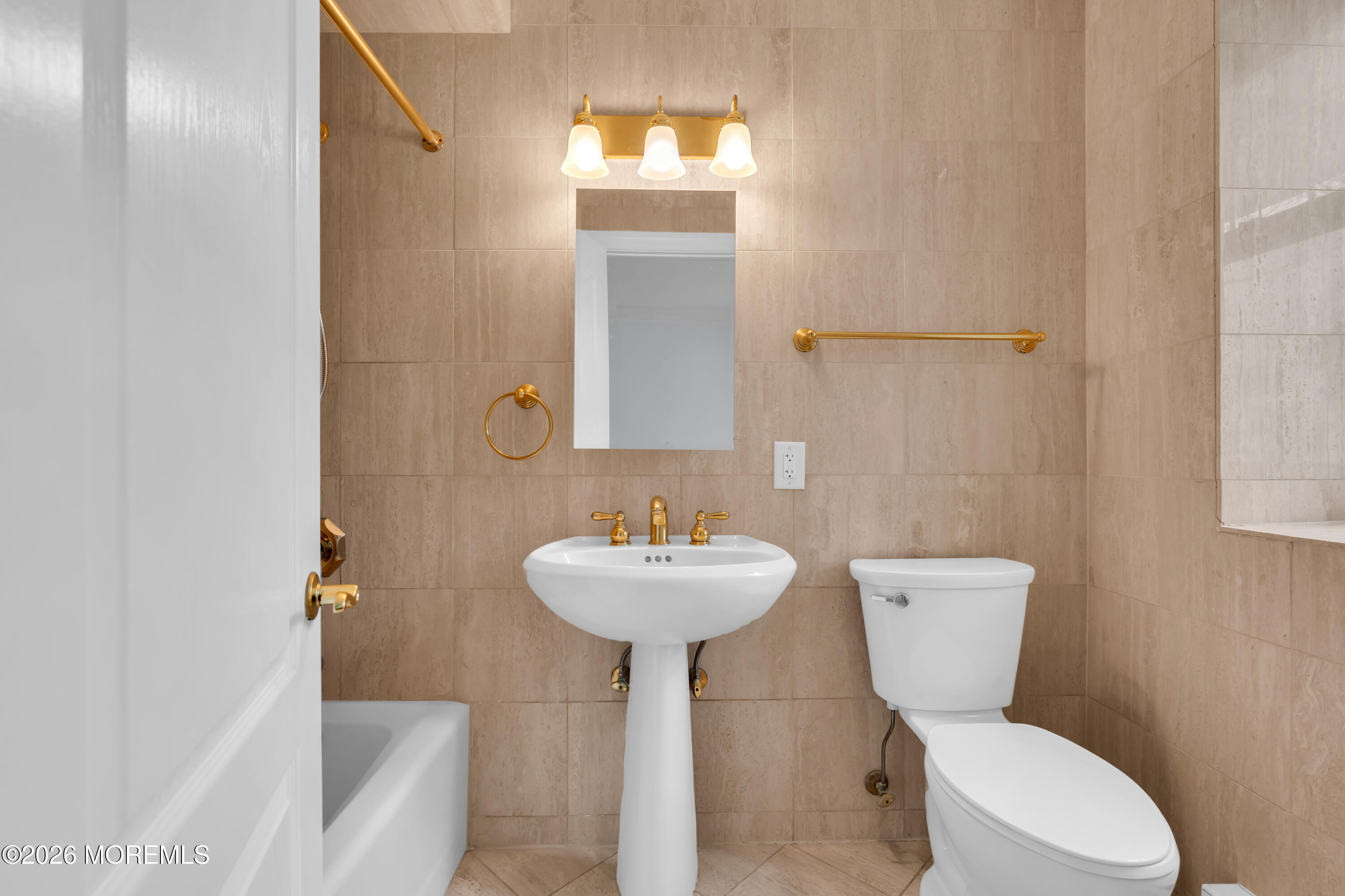 700 Ocean Avenue, Unit G29 Spring Lake, NJ 07762 - Photo 20 of 25 a bathroom with a sink toilet and a mirror