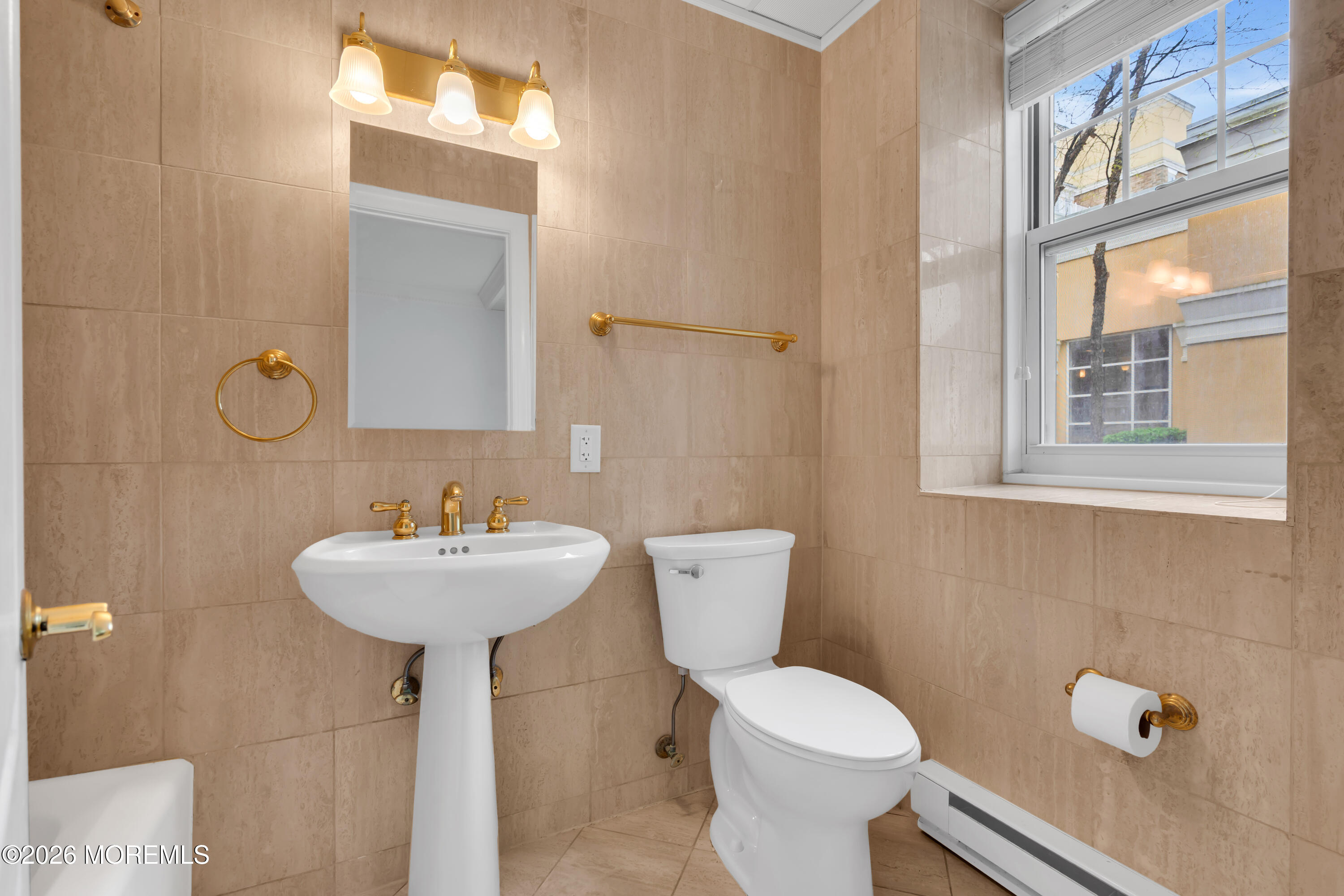 700 Ocean Avenue, Unit G29 Spring Lake, NJ 07762 - Photo 21 of 25 a bathroom with a sink toilet and a mirror