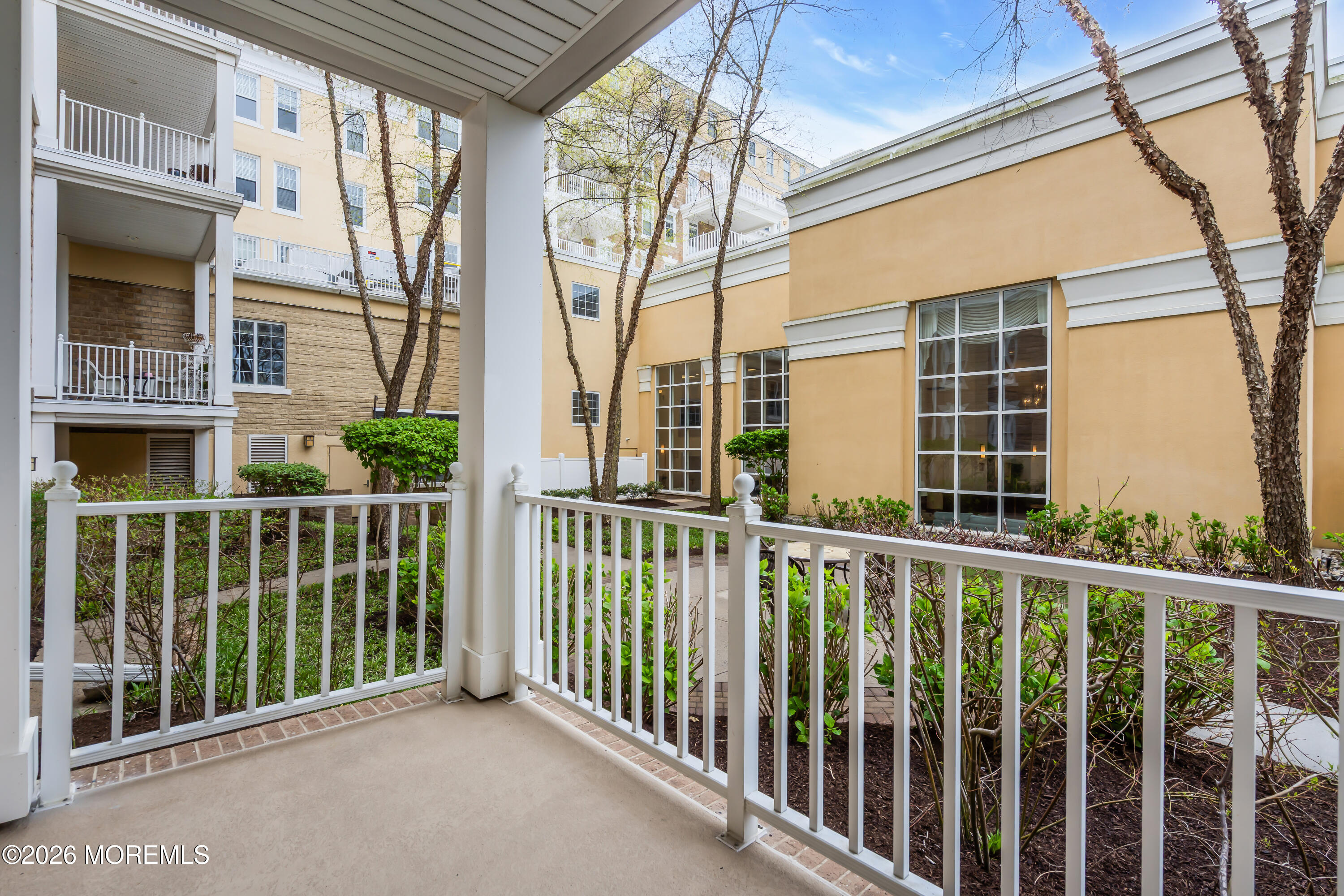 700 Ocean Avenue, Unit G29 Spring Lake, NJ 07762 - Photo 23 of 25 a view of a balcony with wooden floor