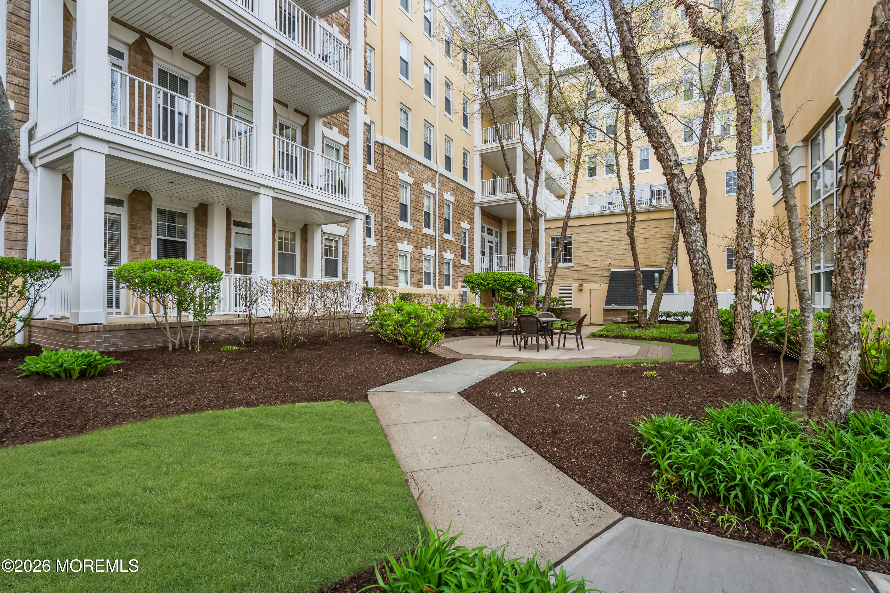 700 Ocean Avenue, Unit G29 Spring Lake, NJ 07762 - Photo 5 of 25 a view of a building with a yard