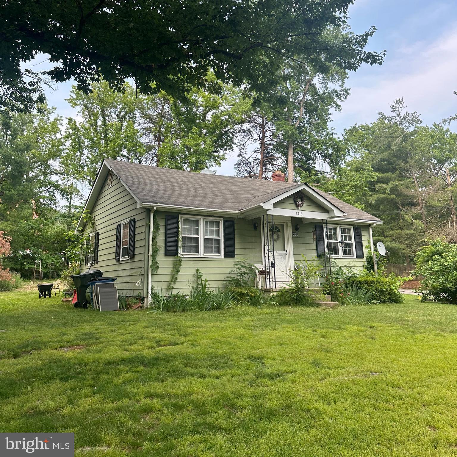 4216 Meyers Road Triangle, VA 22172 - Photo 1 of 3 a front view of a house with a garden