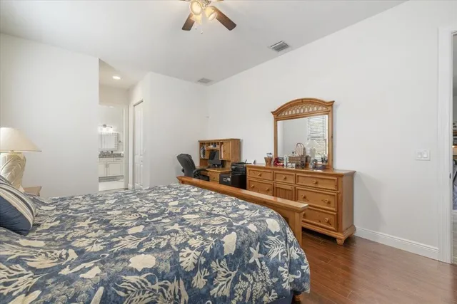 a bedroom with a bed and a dresser