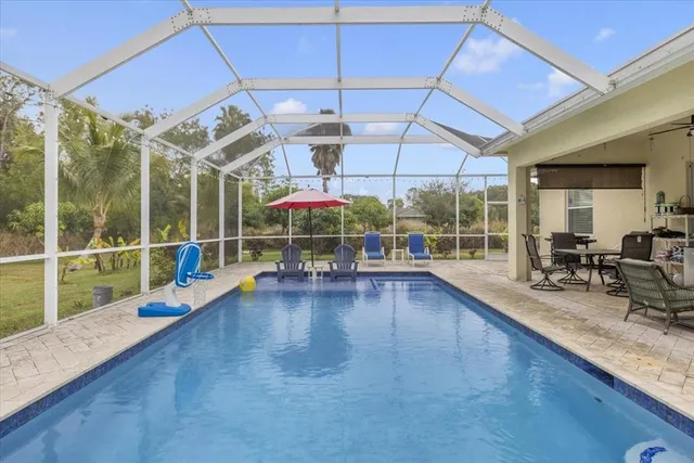 a view of a swimming pool with a porch