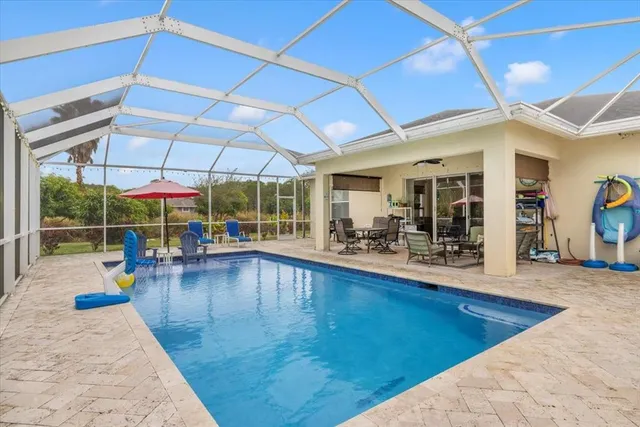 a view of a swimming pool with a patio