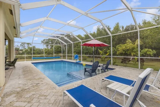 a view of a roof deck with wooden floor and city view