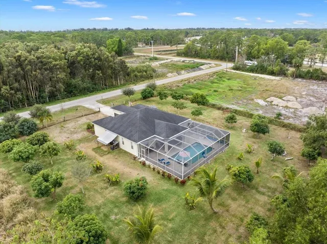 a backyard of a house with lots of green space