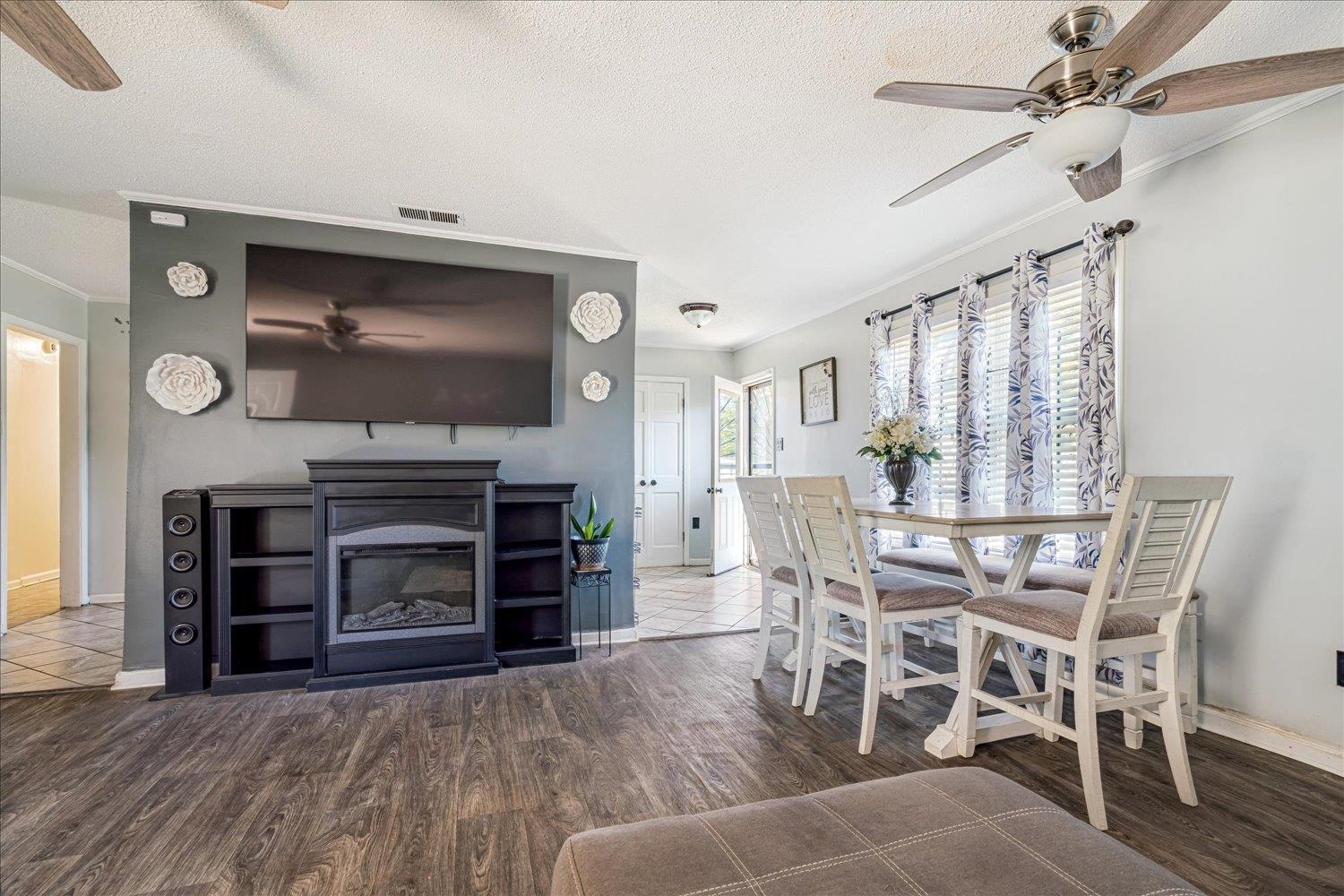 4340 Bluebell Street Memphis, TN 38109 - Photo 11 of 29 a view of a livingroom with furniture and a flat screen tv
