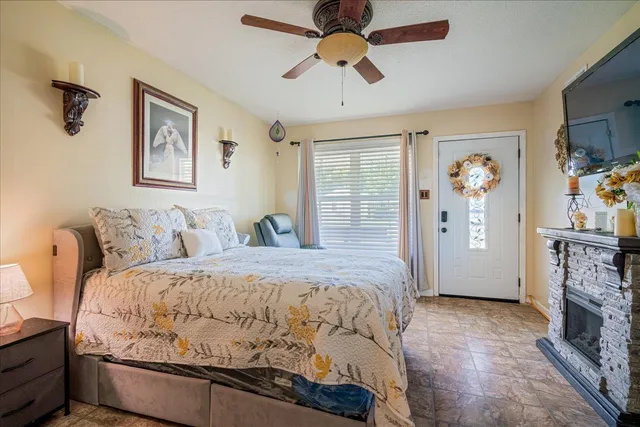 a bed room with a bed and a television