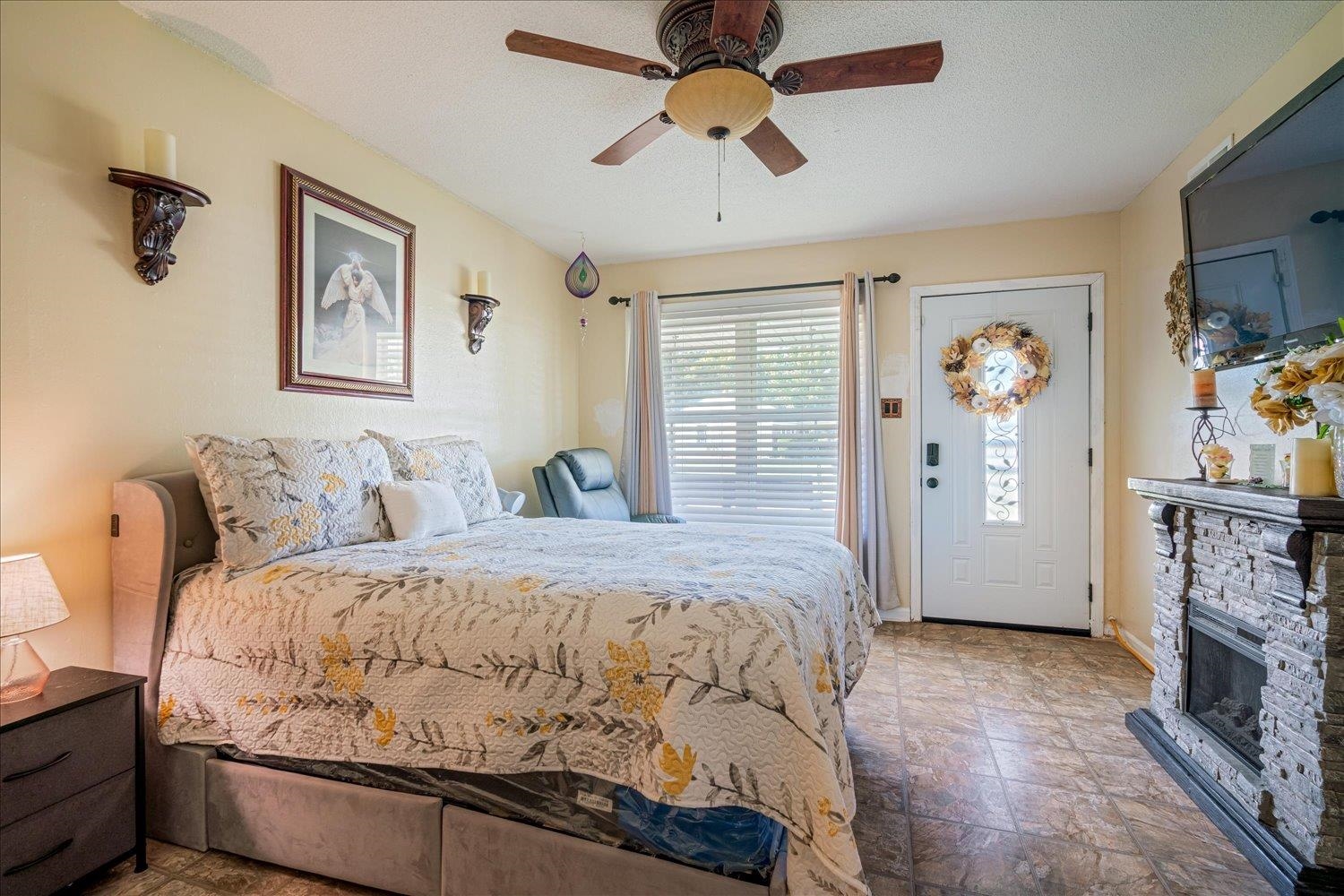 4340 Bluebell Street Memphis, TN 38109 - Photo 18 of 29 a bedroom with a bed and ceiling fan