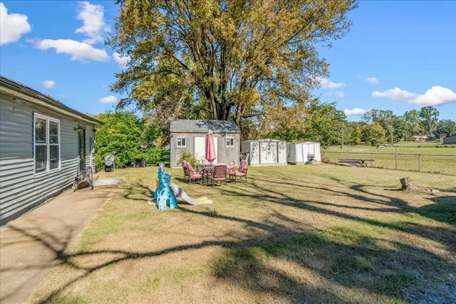 a swimming pool view with a outdoor seating