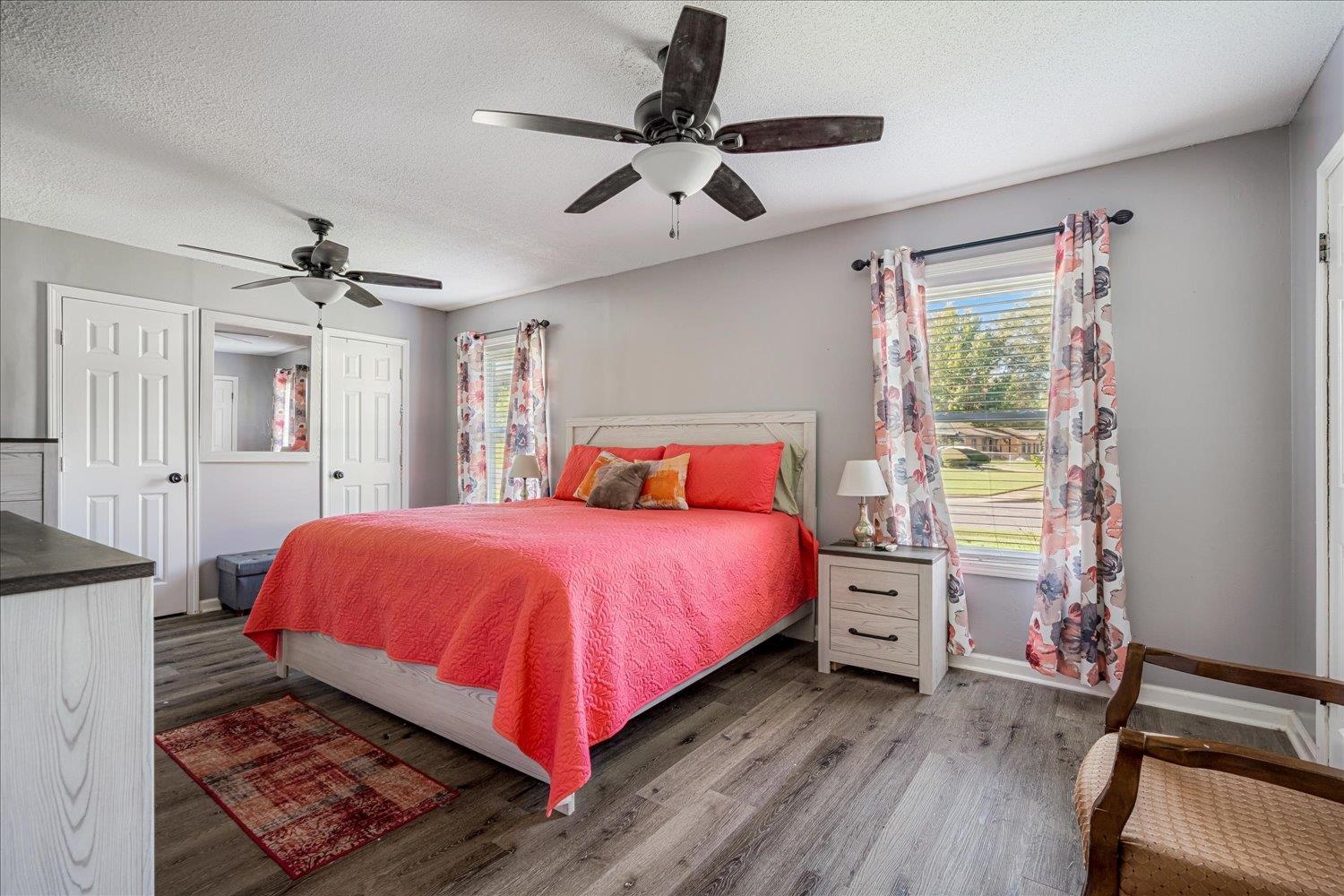 4340 Bluebell Street Memphis, TN 38109 - Photo 23 of 29 a bedroom with a bed and a chandelier