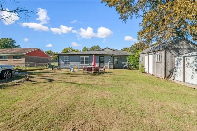 a view of an house with swimming pool and porch
