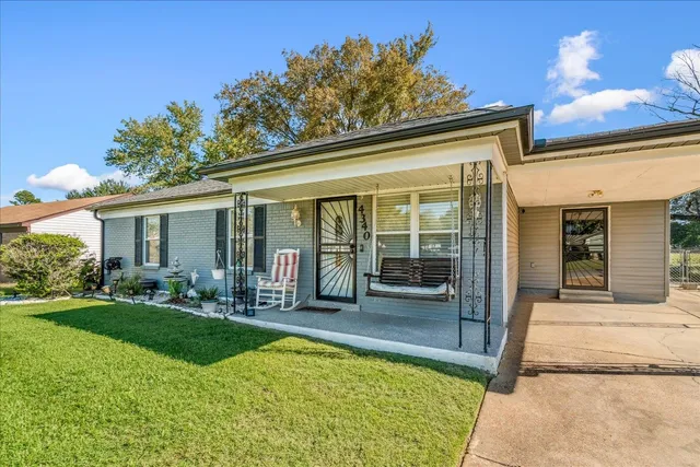 front view of a house with a patio