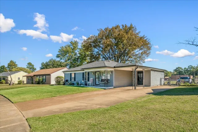 a house view with a garden space