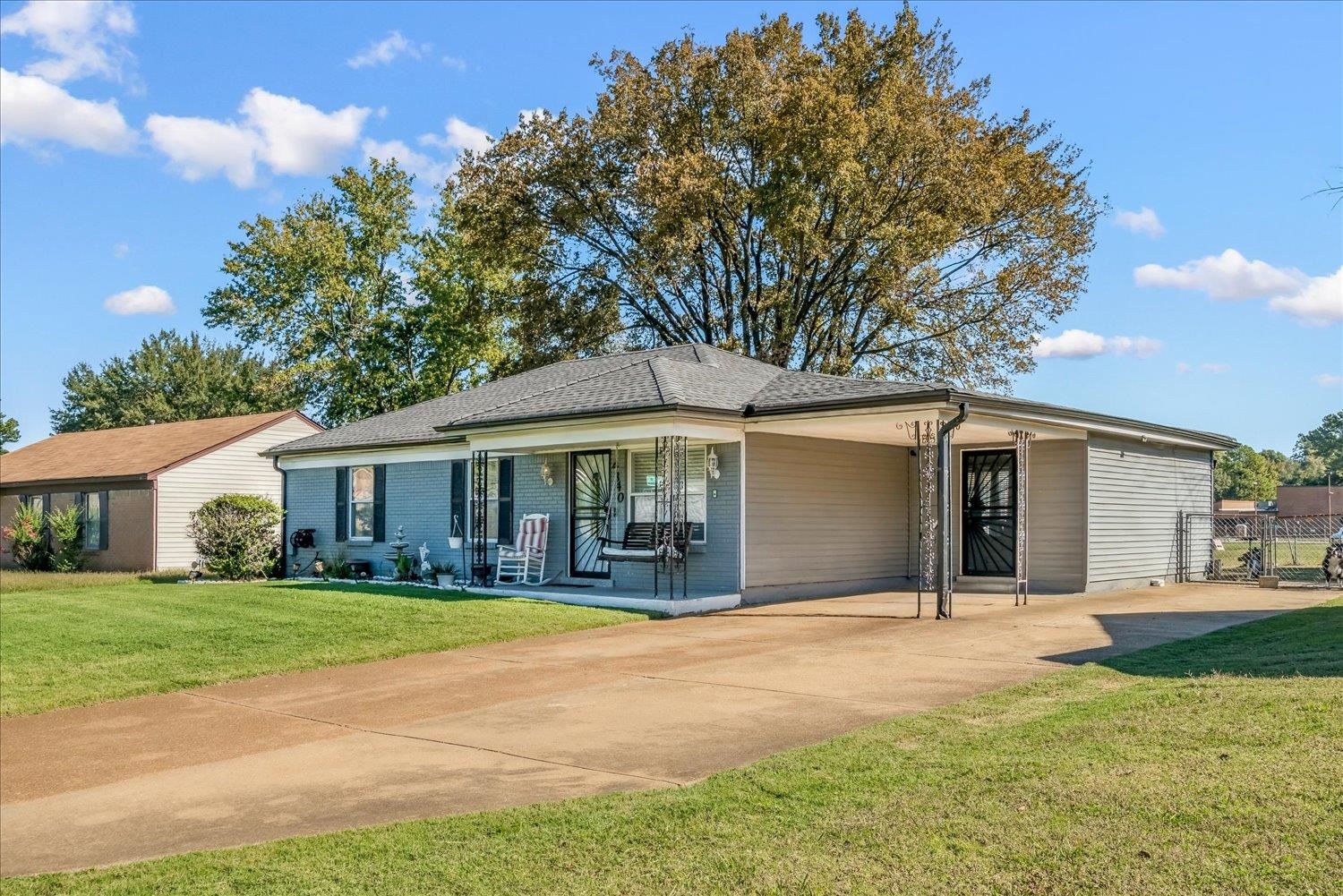 4340 Bluebell Street Memphis, TN 38109 - Photo 5 of 29 a front view of a house with yard and green space