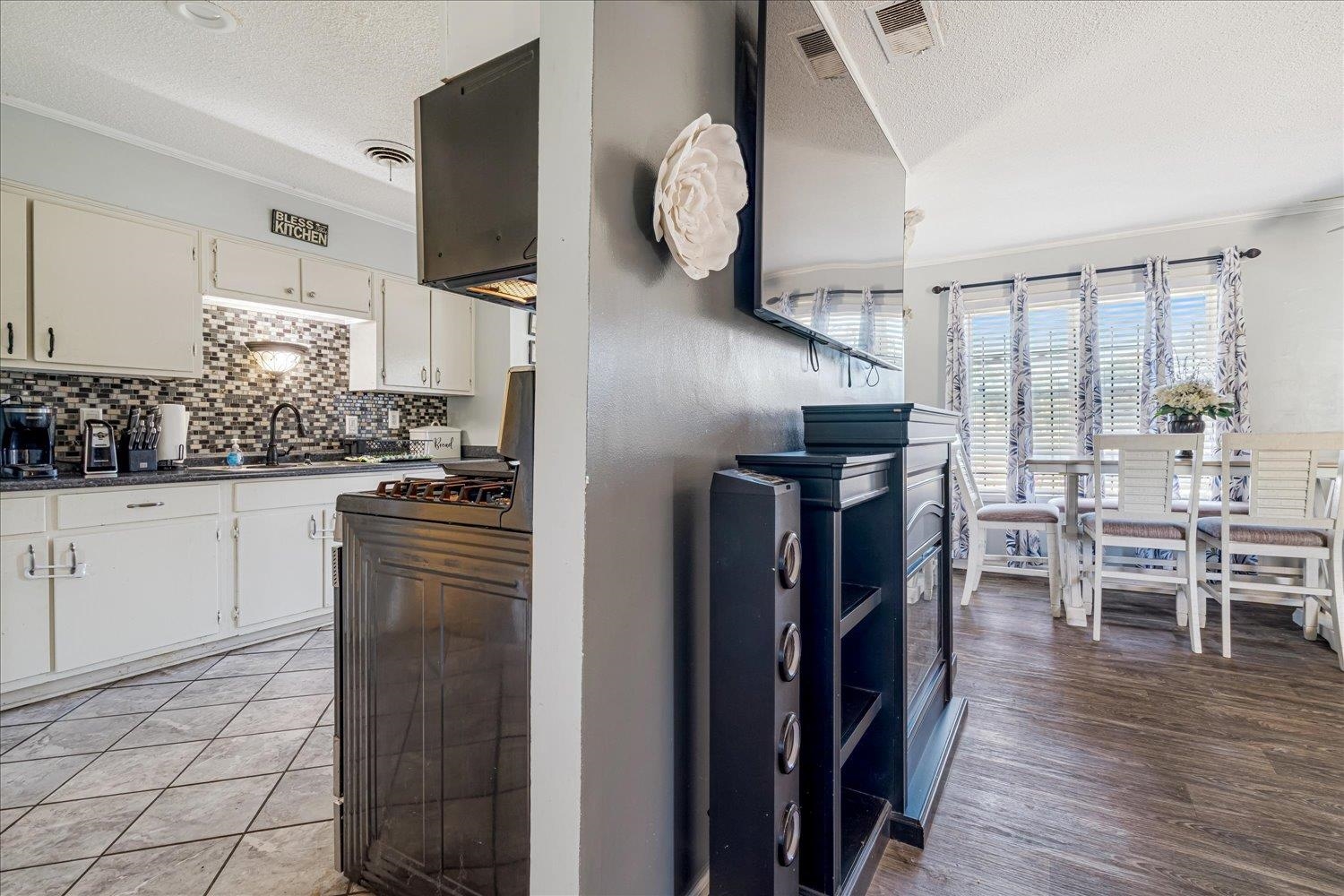 4340 Bluebell Street Memphis, TN 38109 - Photo 8 of 29 a kitchen with stainless steel appliances granite countertop a refrigerator and a stove top oven