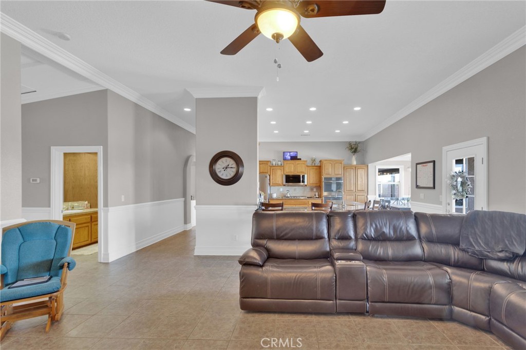 12290 Larch Road Oak Hills, CA 92344 - Photo 20 of 75 a living room with furniture and a large window