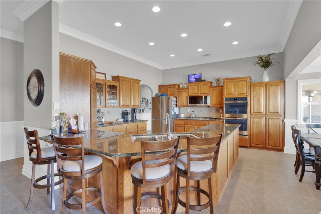 12290 Larch Road Oak Hills, CA 92344 - Photo 21 of 75 a dining room with furniture and window