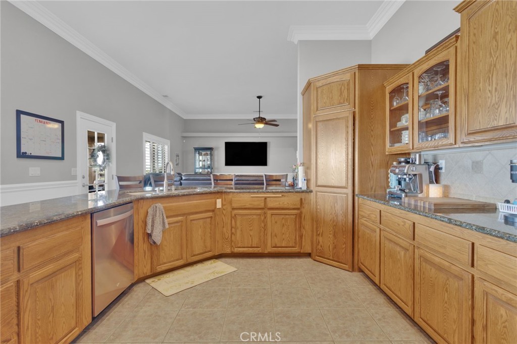 12290 Larch Road Oak Hills, CA 92344 - Photo 23 of 75 a kitchen with stainless steel appliances a refrigerator sink and cabinets