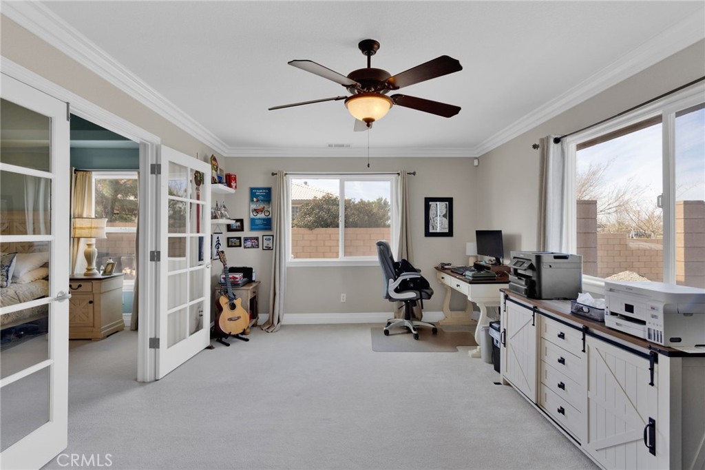 12290 Larch Road Oak Hills, CA 92344 - Photo 31 of 75 a view of a livingroom with lounge chair and windows