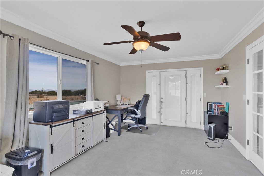 12290 Larch Road Oak Hills, CA 92344 - Photo 32 of 75 a work room with furniture and a window