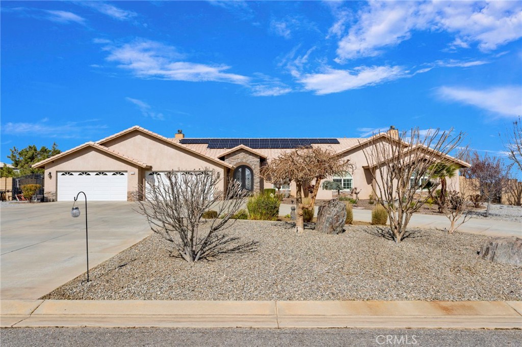 12290 Larch Road Oak Hills, CA 92344 - Photo 4 of 75 a view of a house with a yard