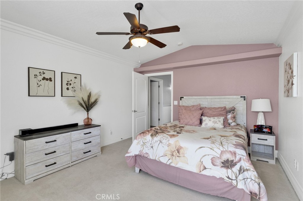 12290 Larch Road Oak Hills, CA 92344 - Photo 44 of 75 a bedroom with a bed and a dresser