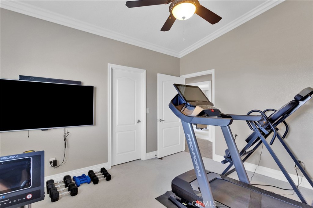 12290 Larch Road Oak Hills, CA 92344 - Photo 46 of 75 a living room with furniture and a flat screen tv