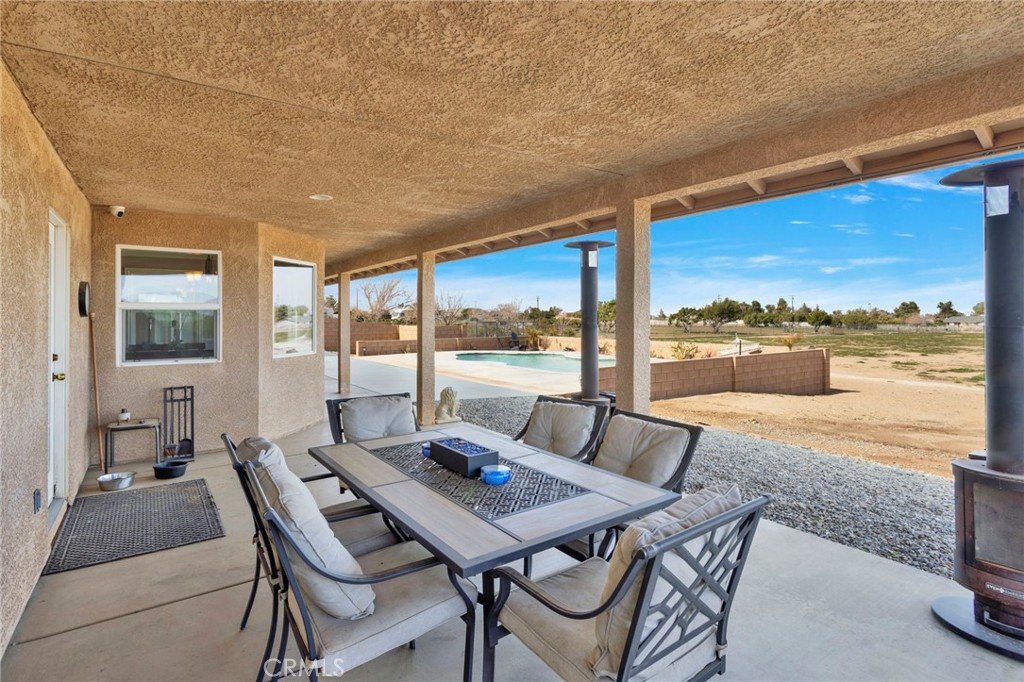 12290 Larch Road Oak Hills, CA 92344 - Photo 57 of 75 a view of a city from a dining room with furniture and window
