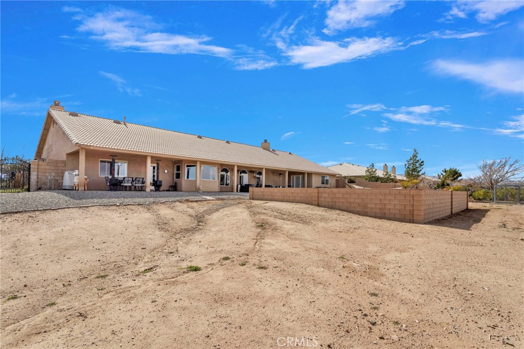 12290 Larch Road Oak Hills, CA 92344 - Photo 67 of 75 a front view of a house with a yard