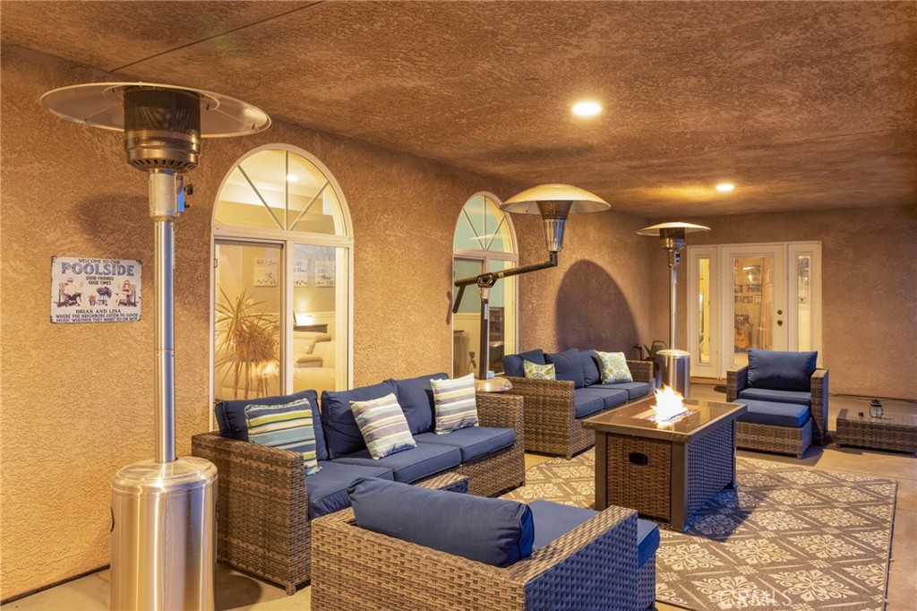 12290 Larch Road Oak Hills, CA 92344 - Photo 73 of 75 a living room with furniture and a window