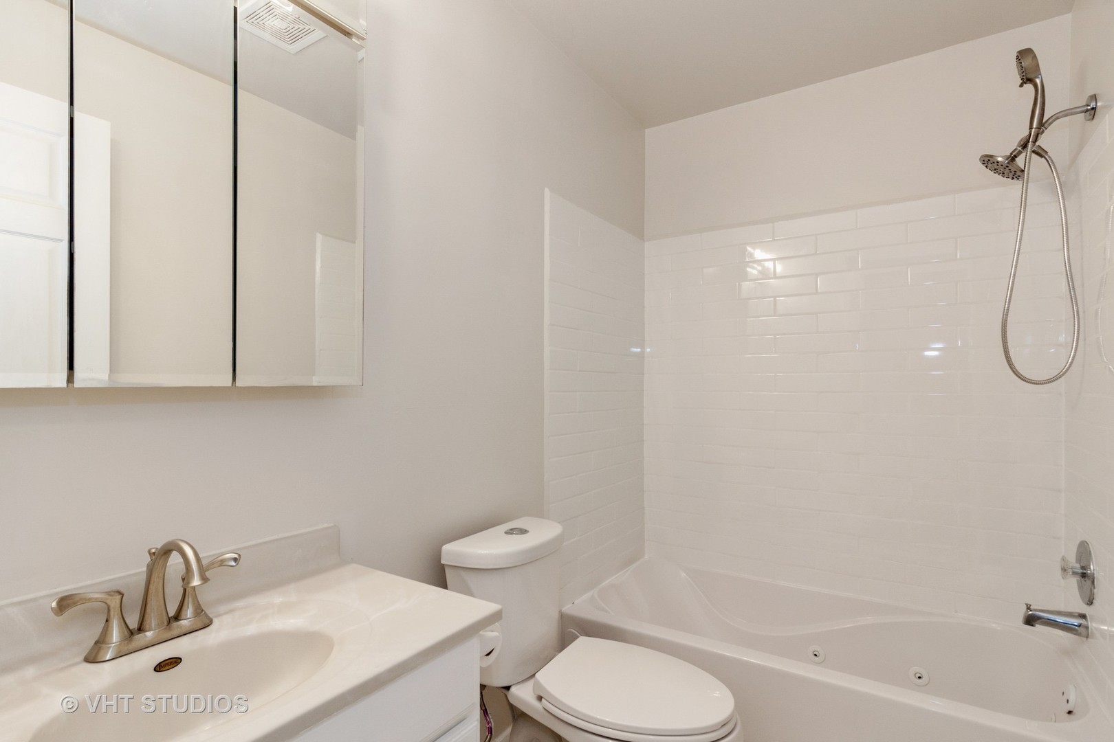 1352 McDowell Road, Unit 103 Naperville, IL 60563 - Photo 11 of 12 a bathroom with a sink toilet and shower