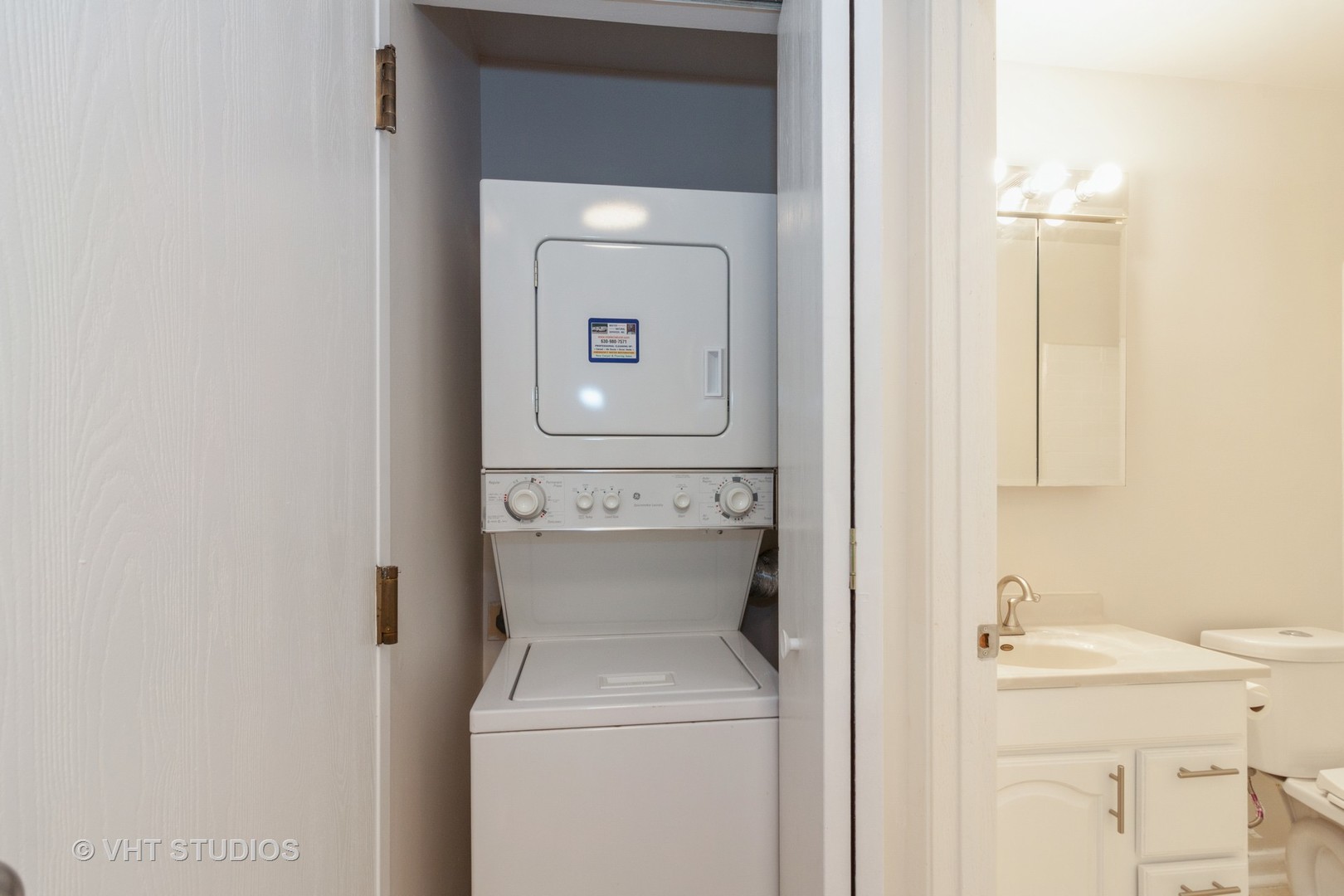 1352 McDowell Road, Unit 103 Naperville, IL 60563 - Photo 12 of 12 a bathroom with a toilet and a sink
